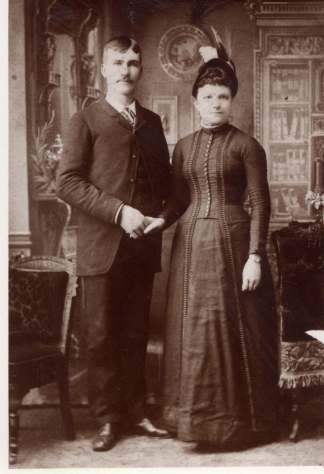 Wedding portrait of Henry and Lillie, Oct. 1889, taken at Erler Sunbeam Gallery, Peoria, Illinois. 