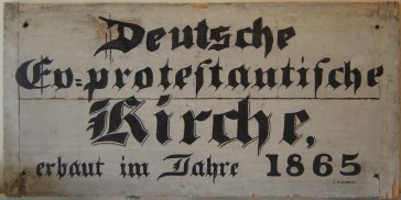 Sign from Marine UCC (now part of a historical display inside the church): “German Ev[angelical] protestant Church, built in year 1865.”